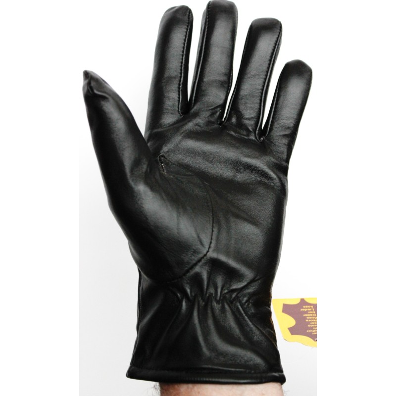 Gant en cuir noir porté vu côté paume, poignet froncé